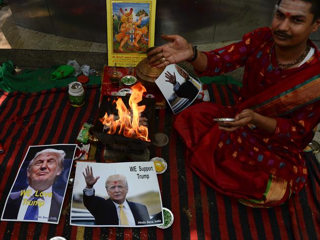 An Indian Hindu priest performs a Hawan (The Sarced Fire) ritual.  Picture:  AFP
