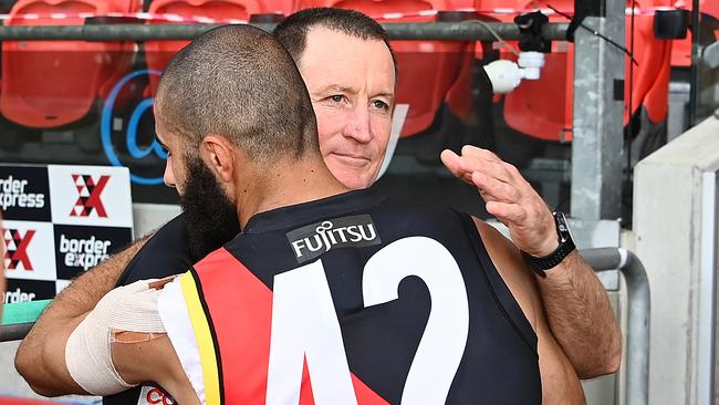 Adam Saad embraces outgoing coach John Worsfold after his final game in Round 18. Picture: Quinn Rooney/Getty Images