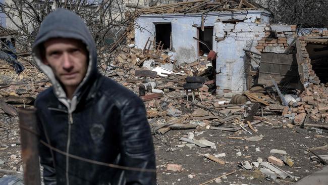 A man stands in front of a house which attacked by Russian forces in the village of Bachtanka near Mykolaiv, a key city on the road to Odessa. Picture: AFP