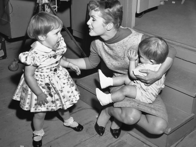 Debbie Reynolds on the set of Say One For Me with two-year-old daughter, Carrie and one-year-old son, Todd. Picture: AP