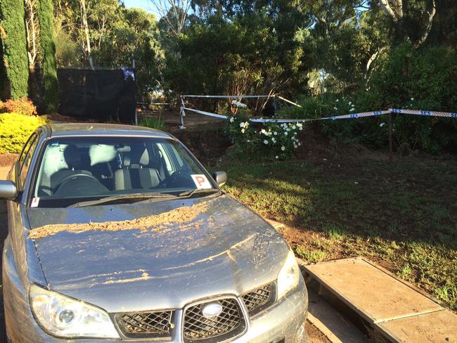 Damage to cars and gardens after the floods in Paradise. Pic: Doug Robertson