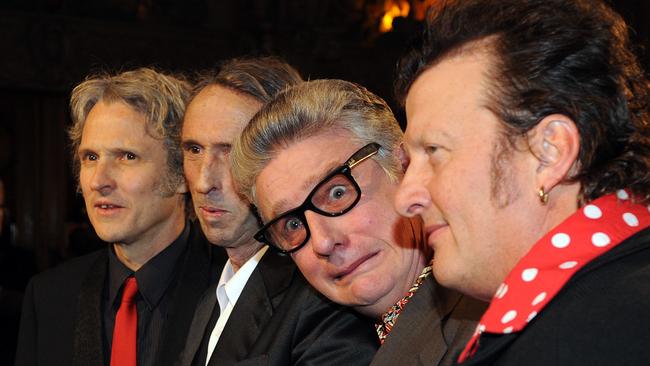 Legendary Australian pop band Mental As Anything members (L to R) Peter O'Doherty, Chris O'Doherty (also known as Reg Mombassa), Greedy Smith and Martin Plaza pose for photographs on the Red Carpet at the 2009 ARIA Hall Of Fame Awards at the Forum Theatre in Melbourne, Thursday, Aug. 27, 2009. The band, along with Kev Carmody, Little Pattie, John Paul Young and The Dingoes will be inducted into the 2009 Hall Of Fame. (AAP Image/Joe Castro) NO ARCHIVING