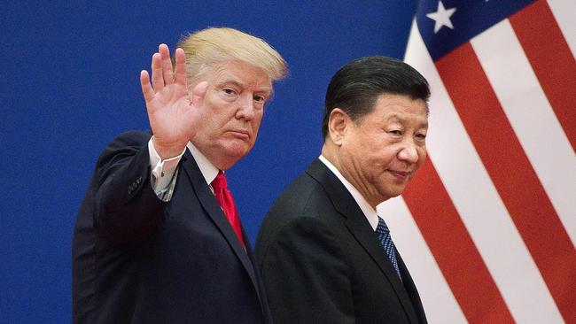 US President Donald Trump and China's President Xi Jinping leaving a business leaders event at the Great Hall of the People in Beijing.