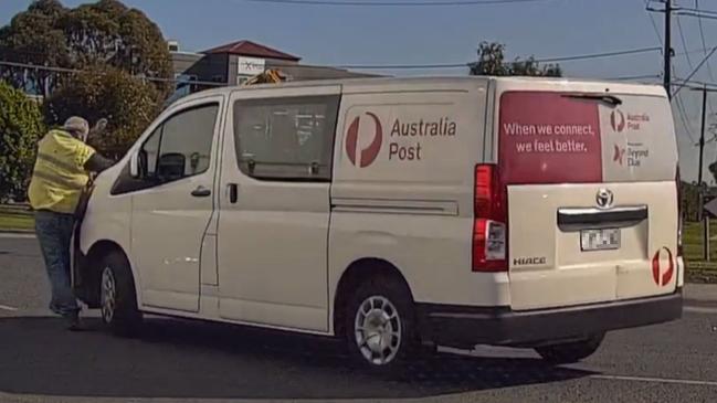 The truck driver left his cabin to confront the Australia Post driver through their window. Picture: Dash Cam Footage Australia / Facebook