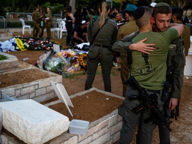 Mourners grieve for Staff Sergeant Shai Arus, 20, during his funeral at the Holon Military Cemetery in Holon, Israel. Picture: Getty Images