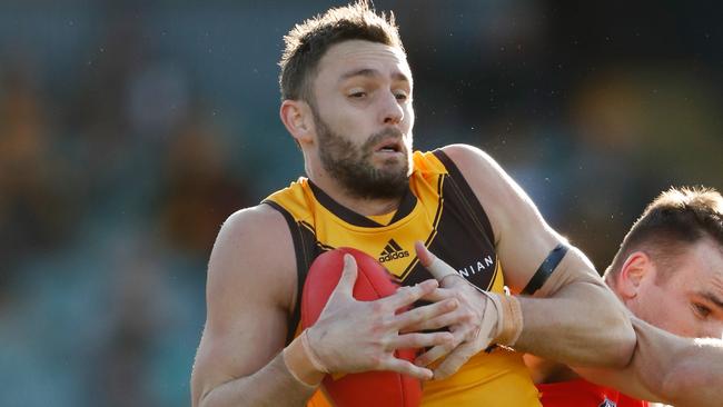 LAUNCESTON, AUSTRALIA - AUGUST 06: Jack Gunston of the Hawks marks the ball over Caleb Graham of the Suns during the 2022 AFL Round 21 match between the Hawthorn Hawks and the Gold Coast Suns at UTAS Stadium on August 6, 2022 in Launceston, Australia. (Photo by Dylan Burns/AFL Photos via Getty Images)