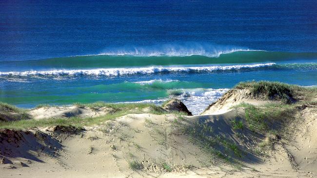 Surf breaks on the beach near Couran Cove Resort on South Stradbroke Island.