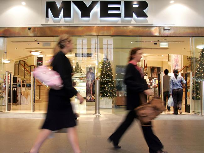 Shoppers walk past a Christmas display at Myer department store at the Queen Victoria Building in central Sydney, Tuesday, Dec. 4, 2006. Research group Cannex announced this week, consumer spending will mean that the country's 13.1 million plus credit cards holders will swipe about $1,300 each over the December period. (AAP Image/Sergio Dionisio) NO ARCHIVING
