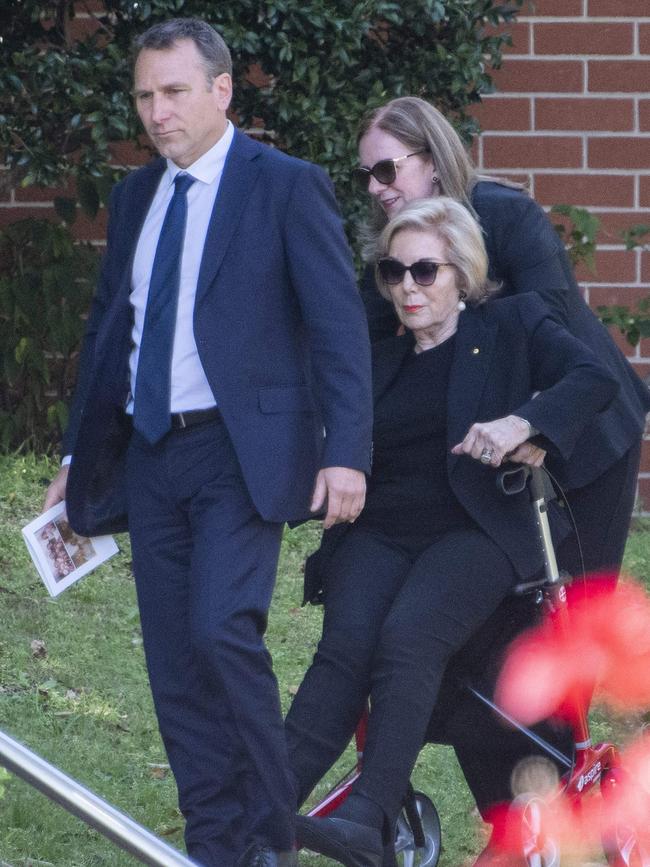 Richie Butrrose, left, and Ita Buttrose, right, join the mourners. Picture: NewsWire / Simon Bullard