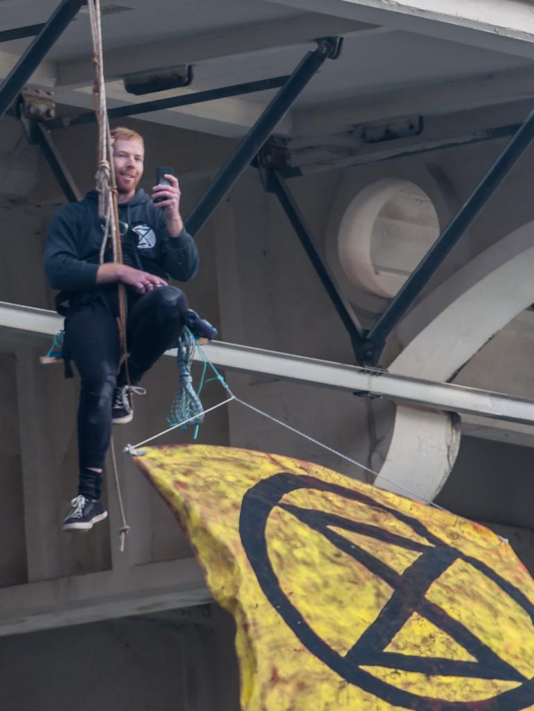 Extinction Rebellion protester abseiling William Jolly Bridge. 19 August 2019. Picture: Supplied.