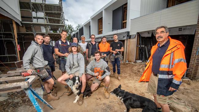 Carlo Corallo and tradies building 13 townhouses that are likely to be torn down for the Suburban Rail Loop in Burwood. Picture: Jason Edwards