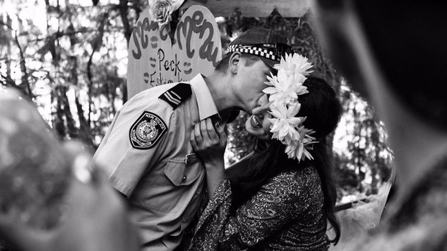 A police officer has explained how he came to be photographed with a festival princess at a kissing booth at Secret Garden Festival near Camden. Picture: Sophie Hill (via Twitter)