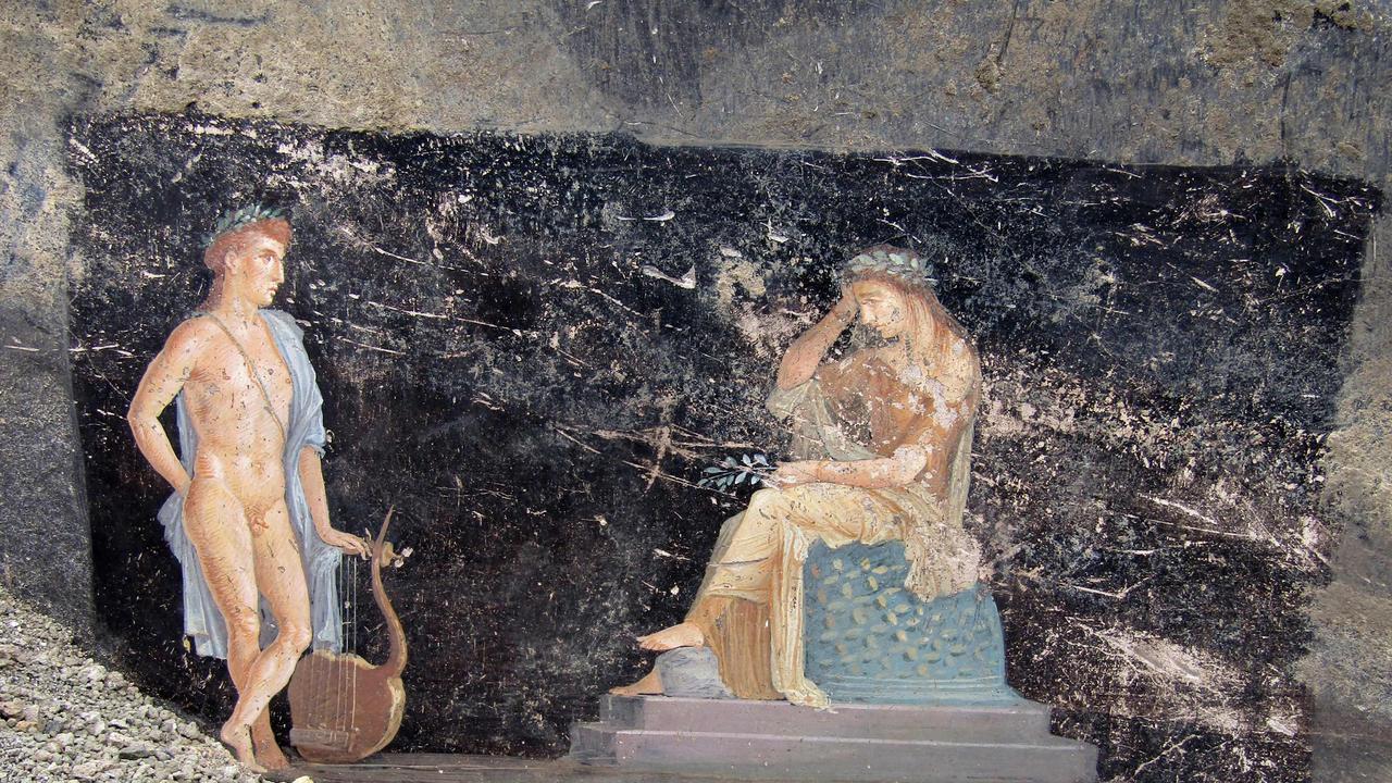 The god Apollo attempts to seduce the seeress Cassandra with his lyre, in this scene from Homer’s epic poems found in a private banquet room. Picture: Archaeological Park of Pompeii/AFP