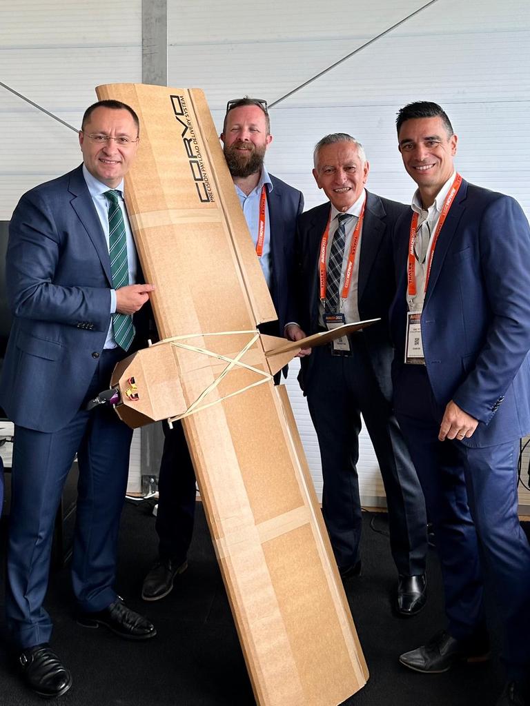 Ukrainian Ambassador Vasyl Myroshnychenko with the Australian-made Precision Payload Delivery System drone and SYPAQ chief engineer Ross Osborne, founder and chairman George Vicino and managing director David Vicino. Picture: Supplied