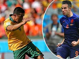 PORTO ALEGRE, BRAZIL - JUNE 18: Tim Cahill of Australia shoots and scores his team's first goal during the 2014 FIFA World Cup Brazil Group B match between Australia and Netherlands at Estadio Beira-Rio on June 18, 2014 in Porto Alegre, Brazil. (Photo by Dean Mouhtaropoulos/Getty Images)