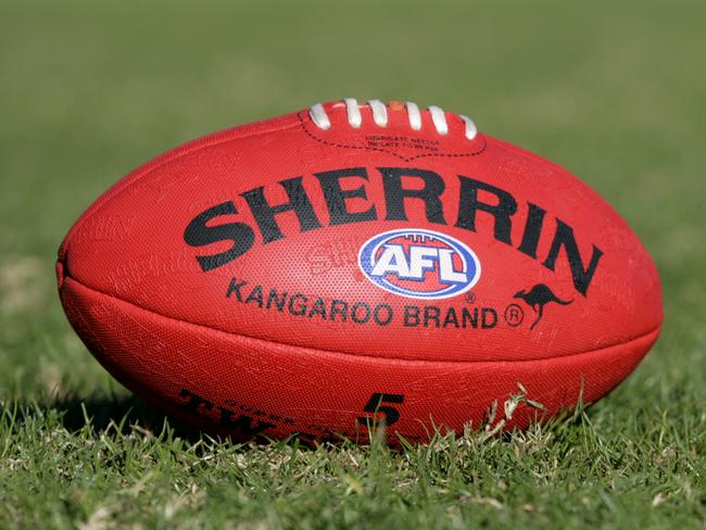 Generic AFL Sherrin football and football boots. sport /