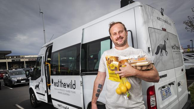 Sorell dad Joshua Phillips is helping vulnerable members of his community get to the supermarket. Picture: CHRIS KIDD