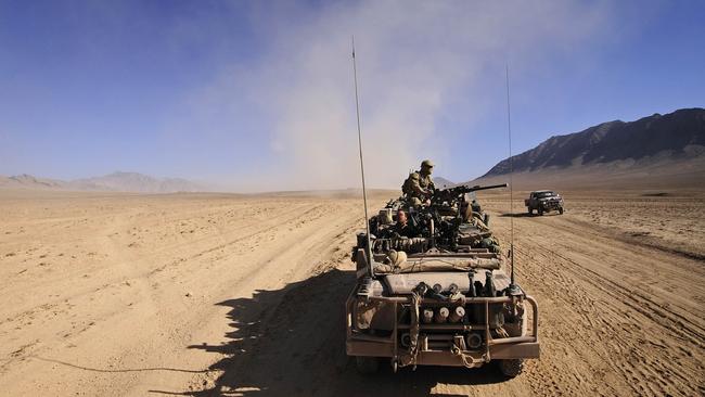 Australian Army soldiers travel through the desert in Uruzgan province during a Special Operations Task Group counterinsurgency operation. Picture: Department of Defence