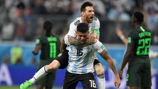 Argentina's defender Marcos Rojo (lower) celebrates his goal with Argentina's forward Lionel Messi during their game against Nigeria.