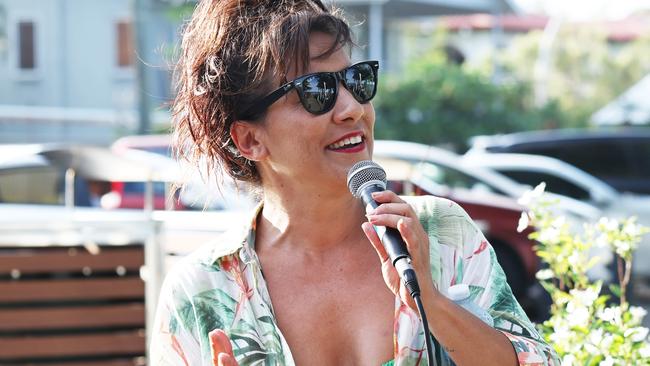 Holloways Beach resident and local hairdresser Crystal MacLennan organised an informal gathering on the beachfront one year on from the flood that devastated the Holloways community. Picture: Brendan Radke