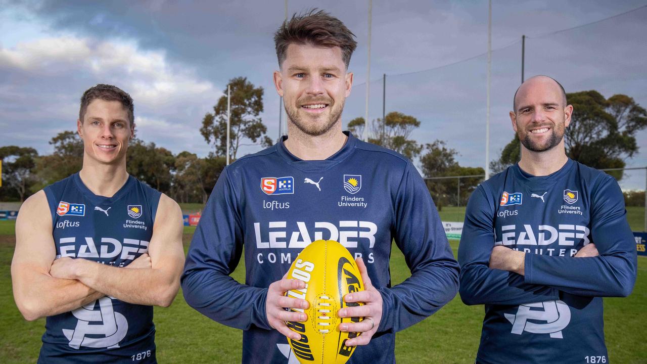 Bryce Gibbs with Matt Rose (left) and Matthew Broadbent. All three will play local footy this year. Picture: Ben Clark