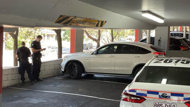 Police at the scene at Redbank Plaza, following a pursuit that left a police car damaged. Picture: Steve Pohlner