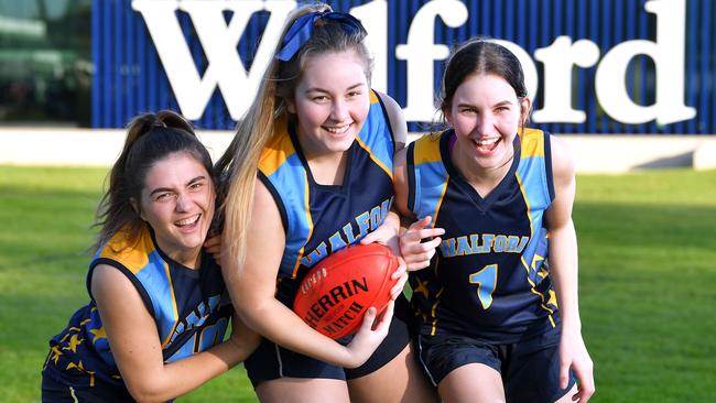 Creating opportunities for girls: Walford Anglican School for Girls students Ashley, Lizzy and Eden play in the school’s senior AFL team. Picture Mark Brake