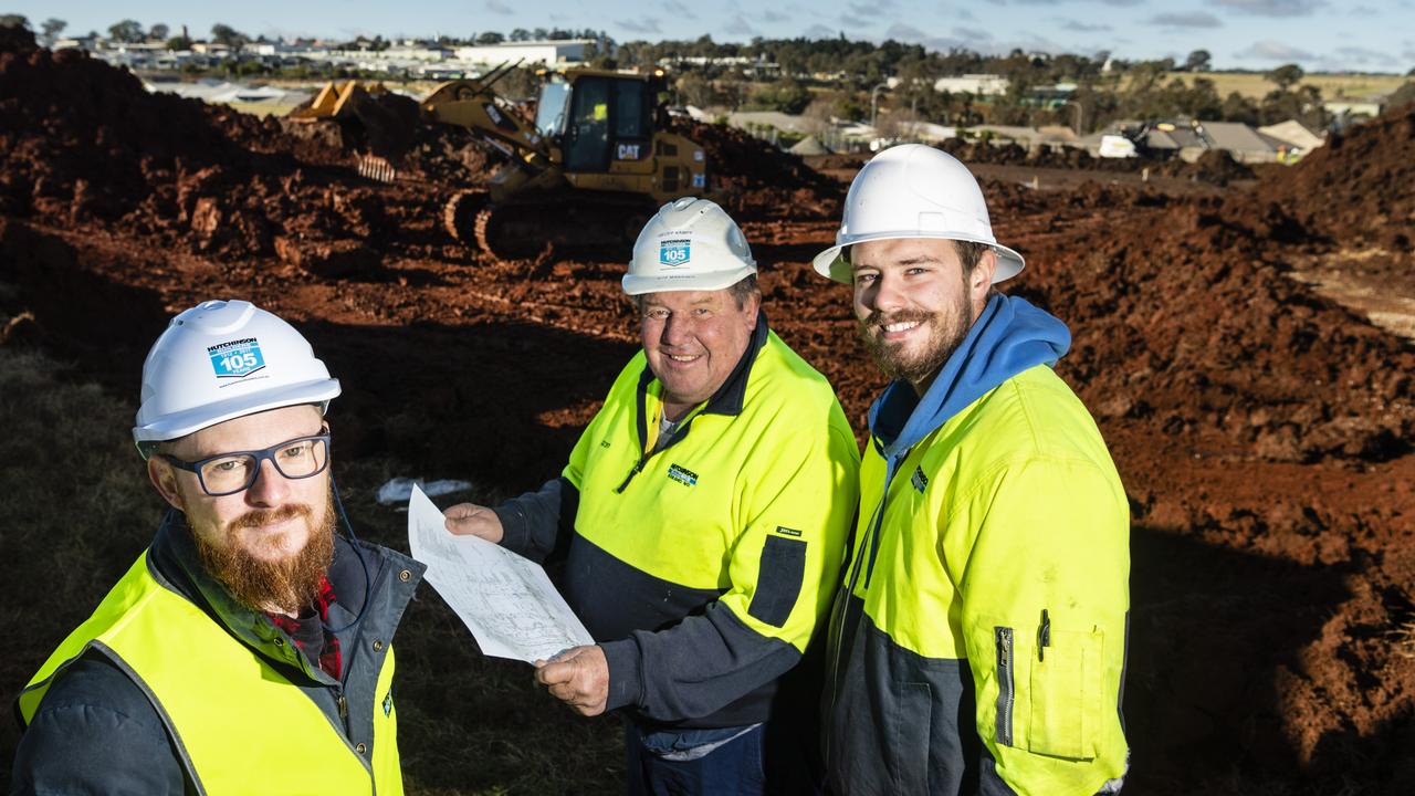 On site are (from left) Hutchinson Builders construction manager Nick Linnan, site manager Geoff Kampf and fourth year apprentice Sean McDonnell at the Greenwattle St construction site of a new medical centre, pharmacy and childcare centre in Glenvale, Friday, July 8, 2022. Picture: Kevin Farmer