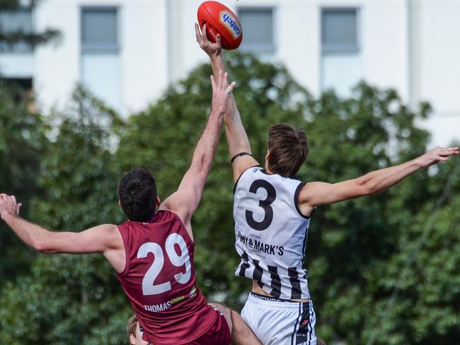 Lachlan Webb (right) contests the ruck against Prince Alfred OC. Picture: Brenton Edwards