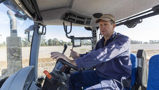 Lawrence Springborg on the tractor at his property. Picture: Mark Cranitch