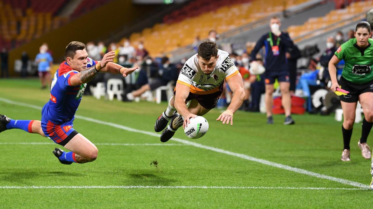 Corey Oates of the Broncos is upended in the tackle during the round  News Photo - Getty Images