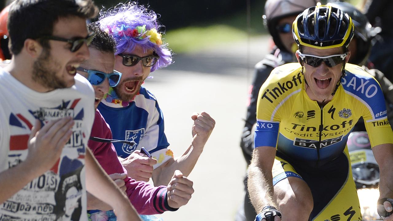 Australia's Micheal Rogers is cheered by fans as he competes on his way to win the 20th stage of the Giro d'Italia, Tour of Italy cycling race, from Maniago to Monte Zoncolan, Italy, Saturday, May 31, 2014. Nairo Quintana virtually clinched the Giro d'Italia title Saturday with a strong ride up the demanding Monte Zoncolan, while Michael Rogers benefited from a fan interruption to post his second stage victory of the race. (AP Photo/Fabio Ferrari)