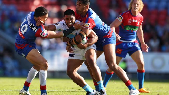 NEWCASTLE, AUSTRALIA - MAY 14: Moeaki Fotuaika of the Titans is tackled during the round 11 NRL match between Newcastle Knights and Gold Coast Titans at McDonald Jones Stadium on May 14, 2023 in Newcastle, Australia. (Photo by Mark Kolbe/Getty Images)