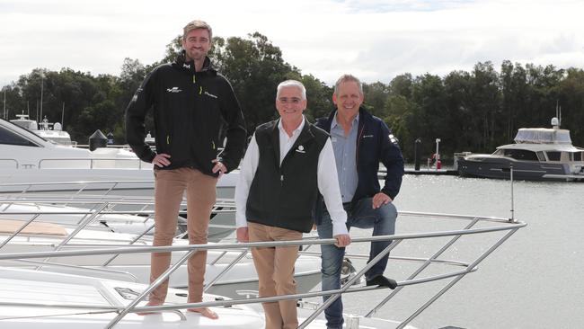 Sanctuary Cove International Boat Show organisers have decided to hold the free festival event over three days from November 13 to 15 after being forced by the COVID pandemic earlier this year to cancel the main event. Left to Right, Tom Barry-Cotter (Maritimo) Stephen Milne (Riviera), Johan Hasser (Mulpha Events). Picture Glenn Hampson