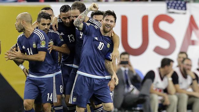 Argentina midfielder Lionel Messi (10) celebrates with teammates.