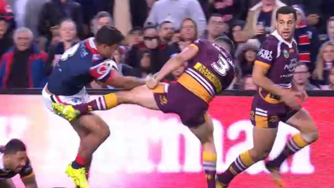 Latrell Mitchell gives James Roberts the big no thank you.