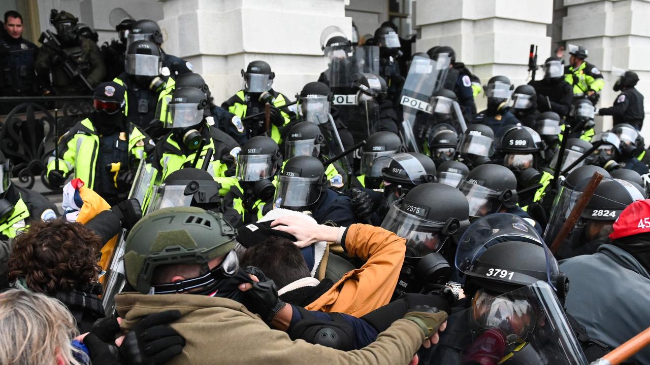 Rioters and police clash during last week’s storming of the Capitol building. The riot prompted social media sites to ban Donald Trump from using them. Picture: Roberto Schmidt/AFP