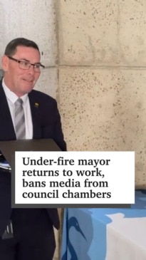 Under-fire mayor returns, bans media from council chambers