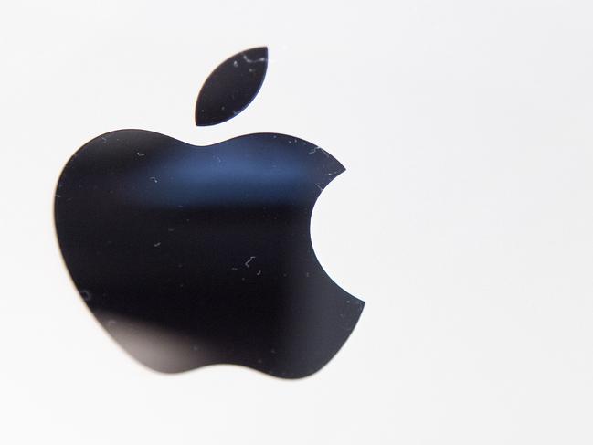 FILE - This June 11, 2015 photo shows the Apple logo on an iMac at an Apple store in New York. Adding fuel to rumors that Apple is working on designs for a car, local officials say engineers for the giant tech company recently made inquiries about a former navy base that's been converted into a testing ground for self-driving cars and other cutting-edge vehicles. An Apple spokesman declined comment Friday, Aug. 14. (AP Photo/Mark Lennihan, File)