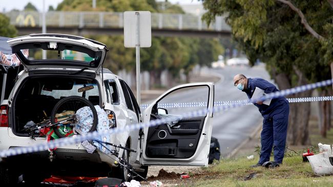 Forensic police examine a vehicle at the scene of a shooting at Corio Picture: David Geraghty