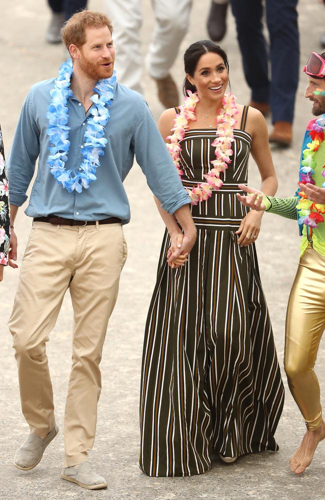 Harry and Meghan (in that Martin Grant dress) on their visit to Bondi Beach on October 19, 2018. Picture: Getty Images