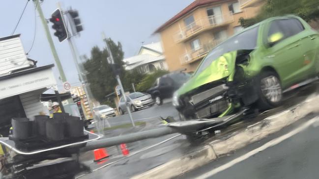 Emergency services were called to a car crashing into a traffic light on Richmond St and Stafford Rd, Gordon Park, just after 6.30am this morning. Picture: Contributed