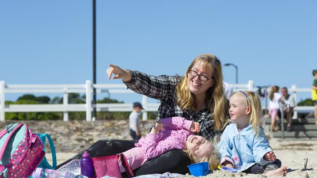 Lyndel King with her daughters Rosie and Leila enjoying Pandanus Beach. Picture: Renae Droop