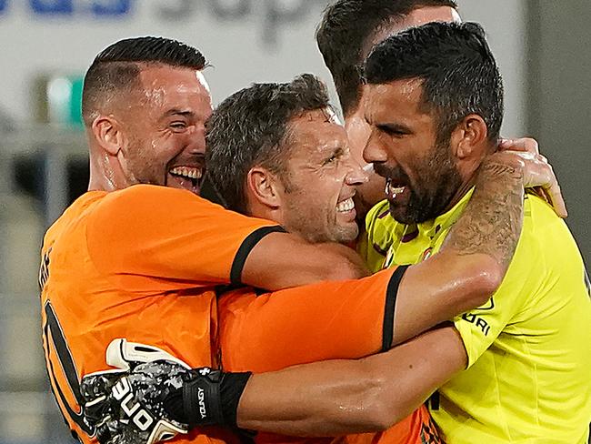 Scott McDonald of the Roar (centre) celebrates after scoring a goal during the Round 24 A-League match between Brisbane Roar and Newcastle Jets at CBus Super Stadium on the Gold Coast, Friday, March 20, 2020. (AAP Image/Dave Hunt) NO ARCHIVING, EDITORIAL USE ONLY