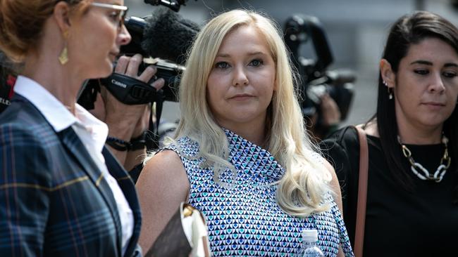 Virginia Giuffre, an alleged victim of Jeffrey Epstein, centre, exits from federal court in New York in August.