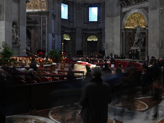 Faithful pay respect at the body of Pope Emeritus Benedict XVI at St. Peter's Basilica in the Vatican, on January 2. Picture: AFP