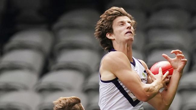 Sam Sturt climbs high to mark during Fremantle’s Round 1 clash with Essendon.