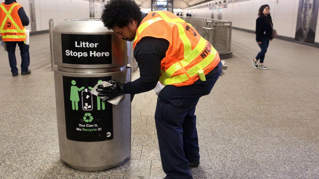 MTA cleaning staff disinfect the 86th St. Q train station on March 4, 2020 in New York City. Six people have been diagnosed with novel coronavirus in the metro New York area, including one community spread infection. Picture: Yana Paskova