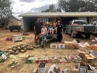 THANK YOU: Rob Bauer, some of his Citizens Who Care helpers and Senior Constable Natalia Timar with the group's donations. Picture: Contributed