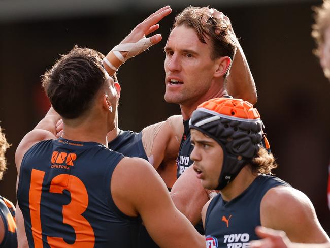 SYDNEY, AUSTRALIA - SEPTEMBER 07: Lachlan Keeffe of the Giants celebrates a goal with teammates during the 2024 AFL First Qualifying Final match between the Sydney Swans and the GWS GIANTS at The Sydney Cricket Ground on September 07, 2024 in Sydney, Australia. (Photo by Dylan Burns/AFL Photos via Getty Images)